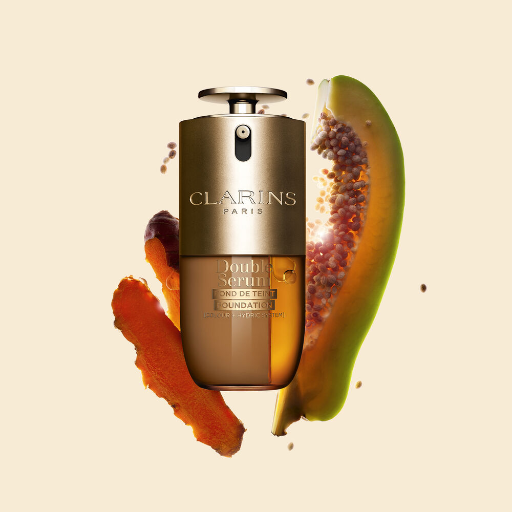 Packshot of Clarins Double Serum Foundation available for every skin tone, featuring key ingredients turmeric and papain