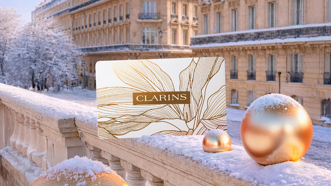 A Clarins gift card in the snow.